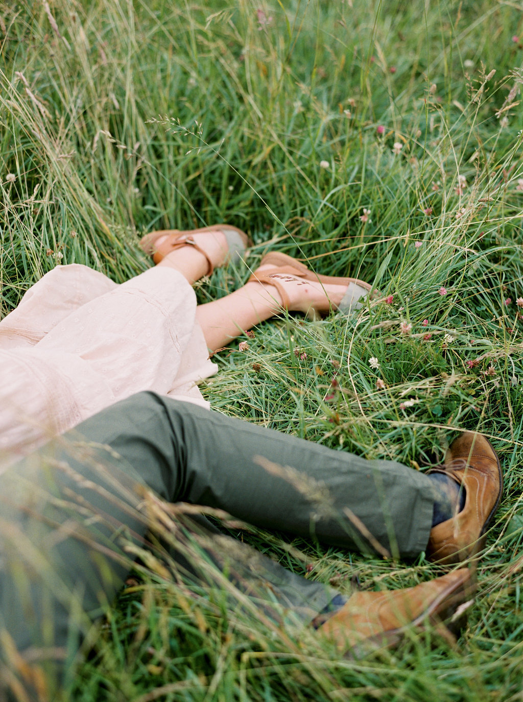 Couple laying in field together in Los Angeles