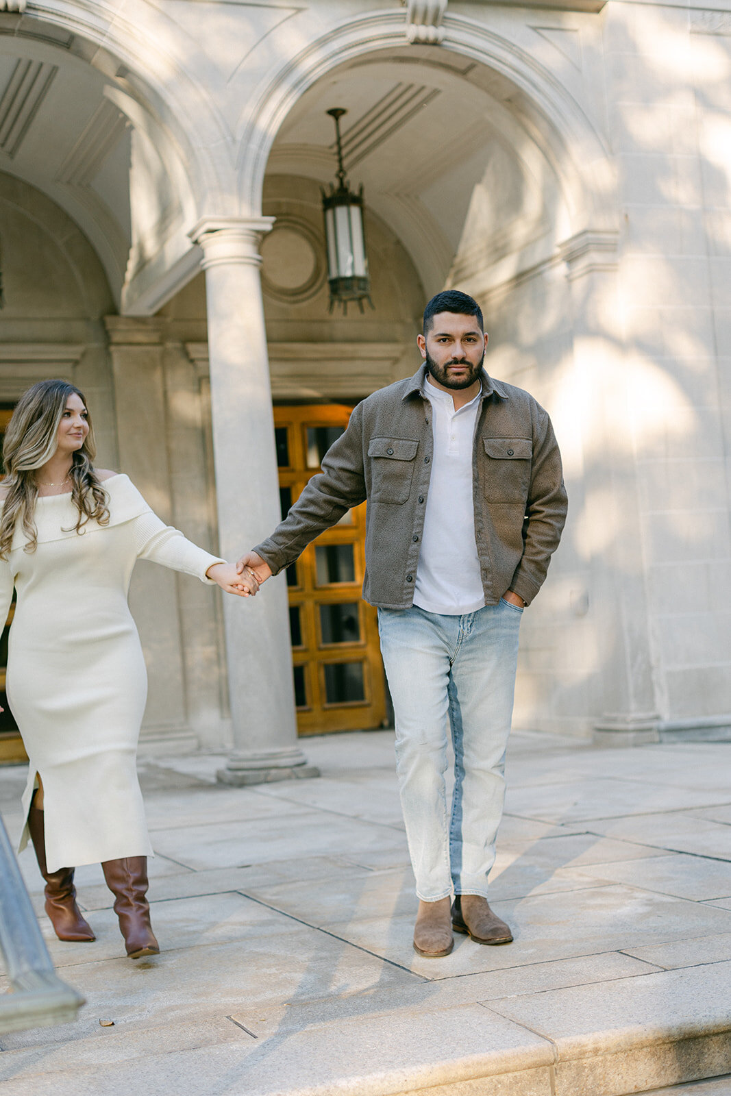 Couple embracing during golden hour engagement session in a Pittsburgh park