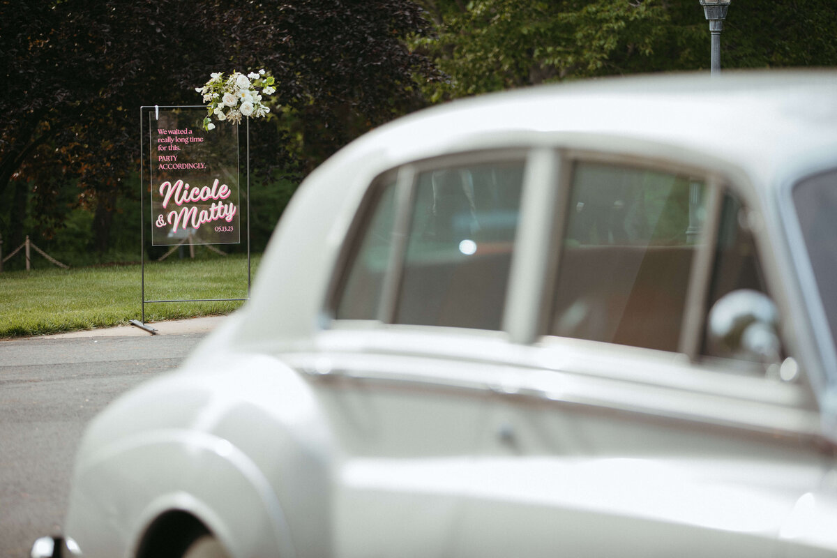 Vintage car and welcome sign