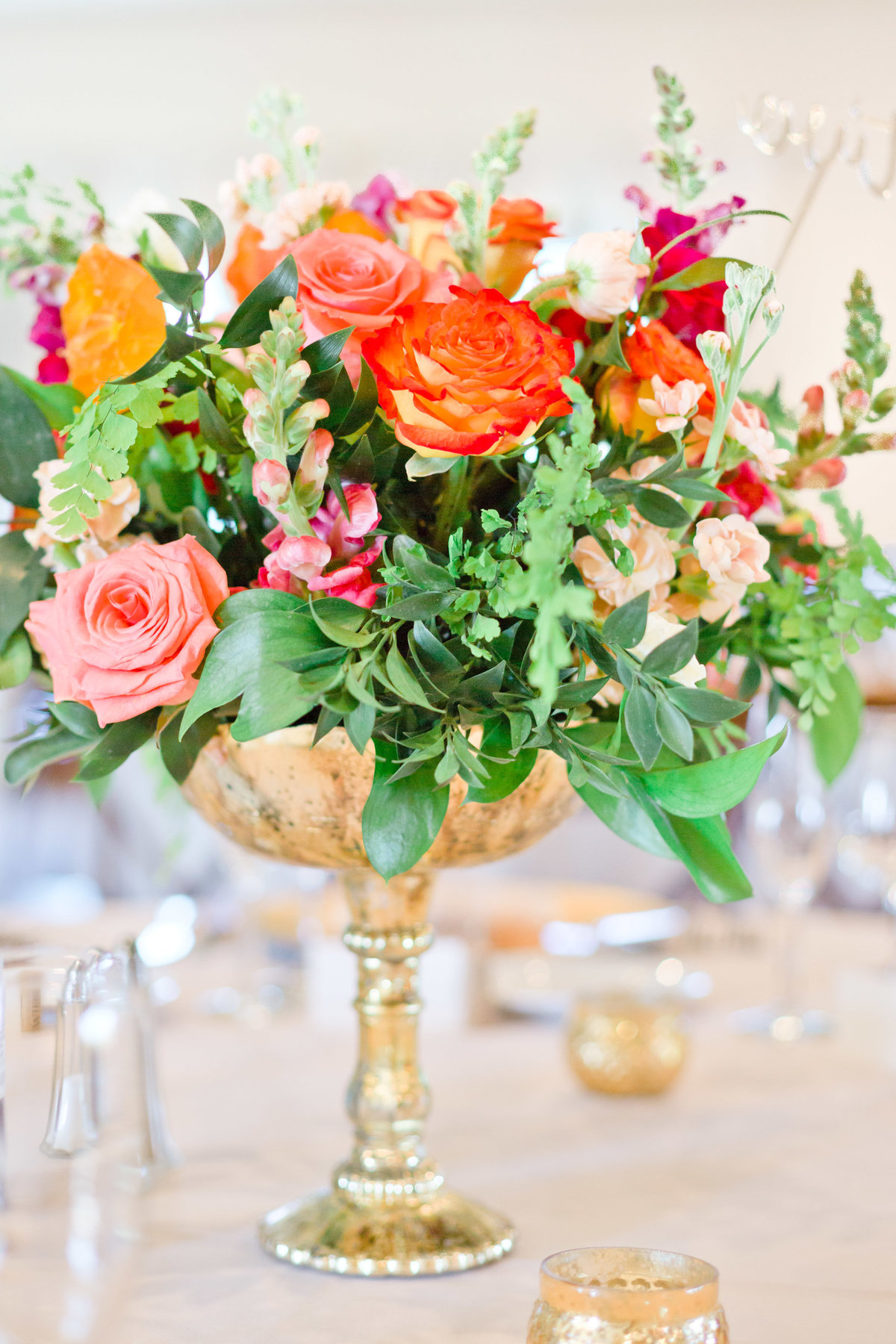wedding centerpiece gold accent roses in spring flowers