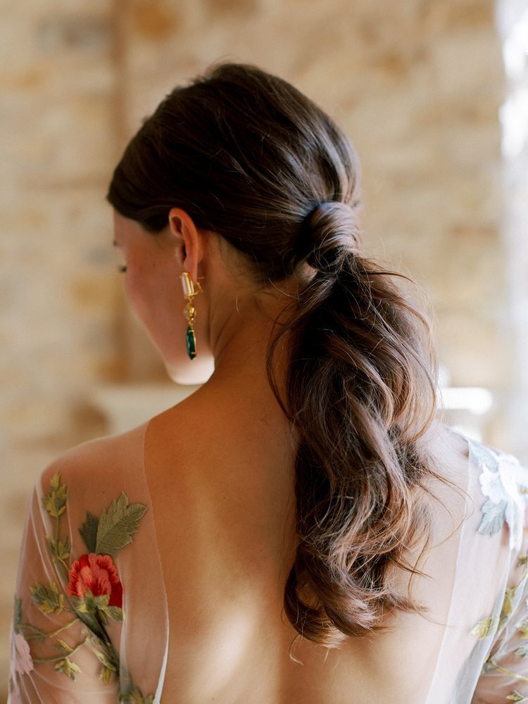 Editorial bridal hairstyle of a low ponytail