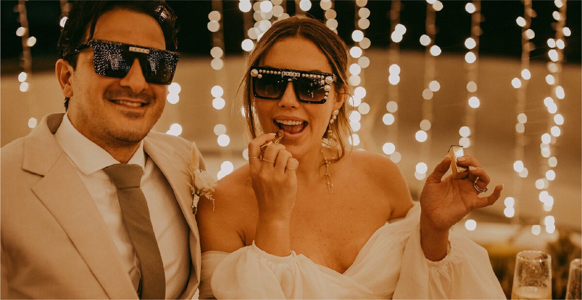 bride and groom with sunglasses on