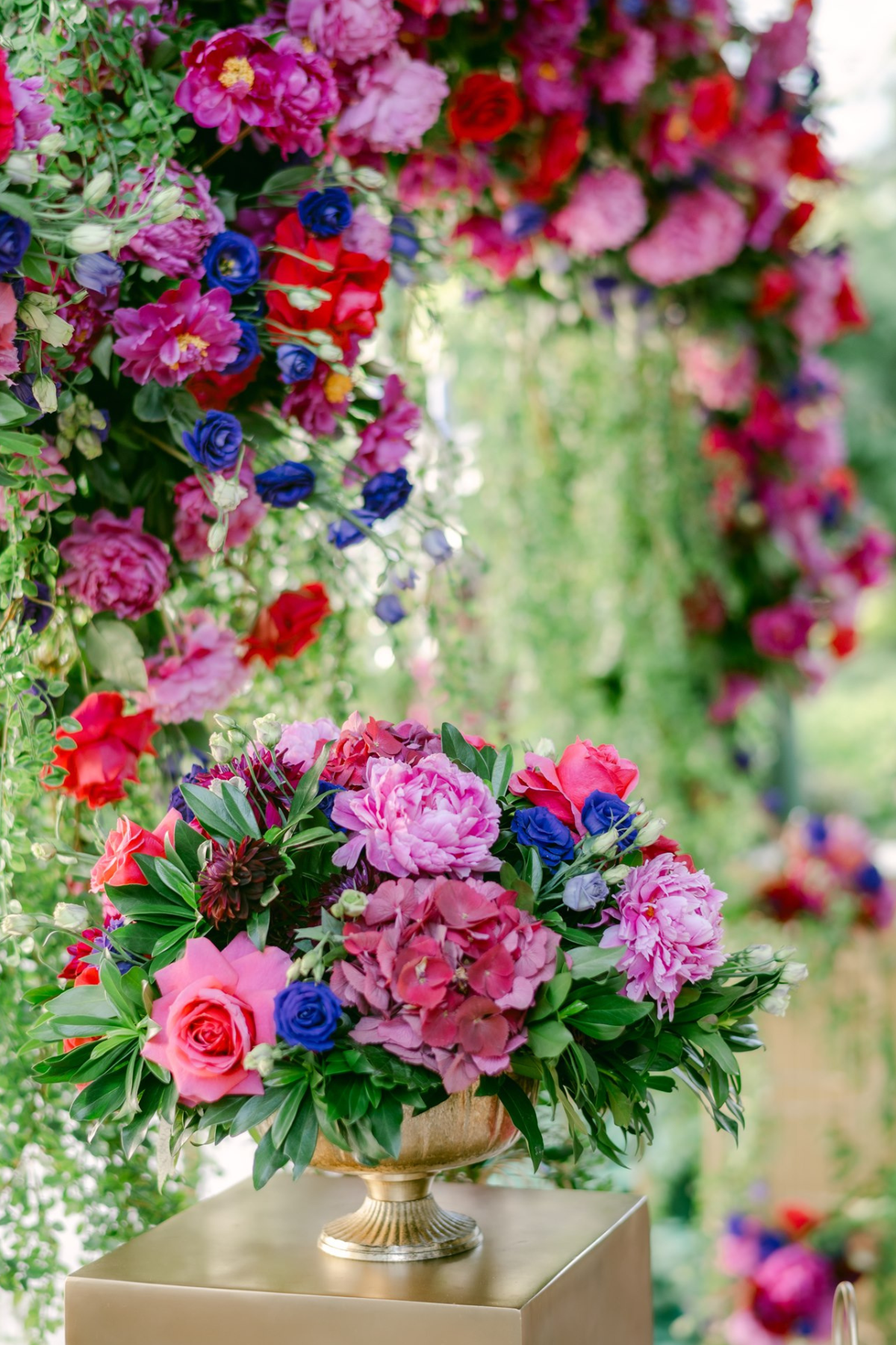 secret-garden-wedding-red-purple-pink-flowers-greenery-centerpiece-gold-vase