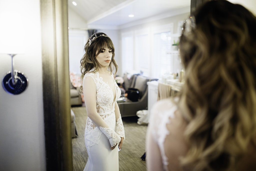 Wedding Photograph Of Woman Holding Her Hand In Front Of a Mirror Los Angeles