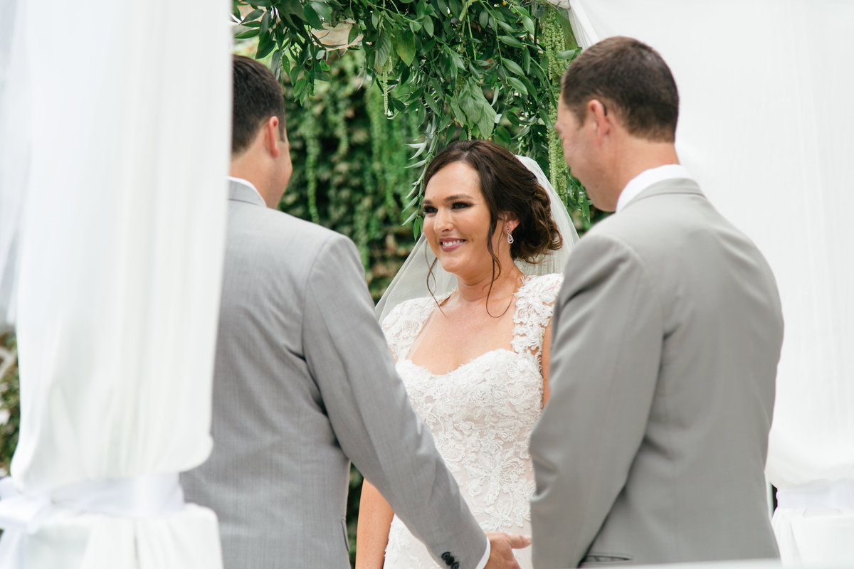 Bride and groom exchange vows at 1880 Union Hotel Wedding