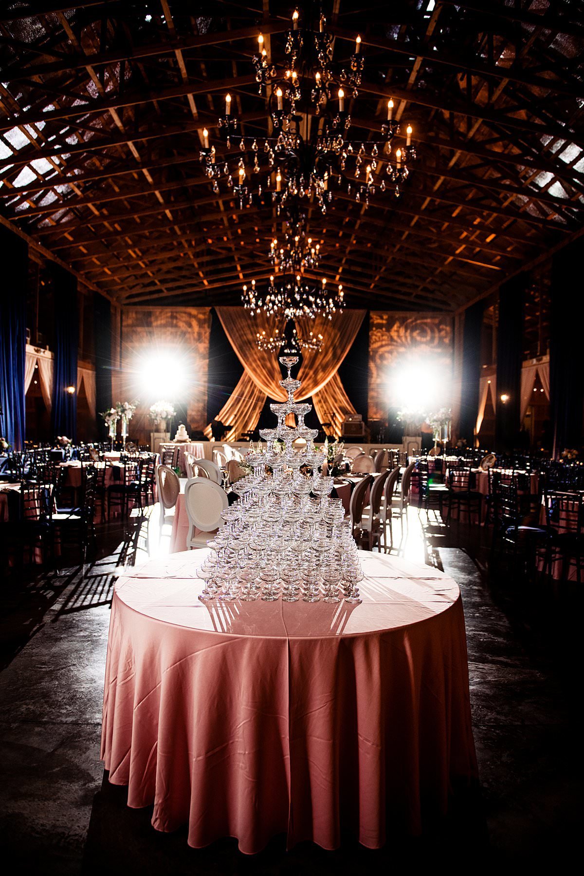 Dramatic photo of a champagne tower inside Saddle Woods Farm