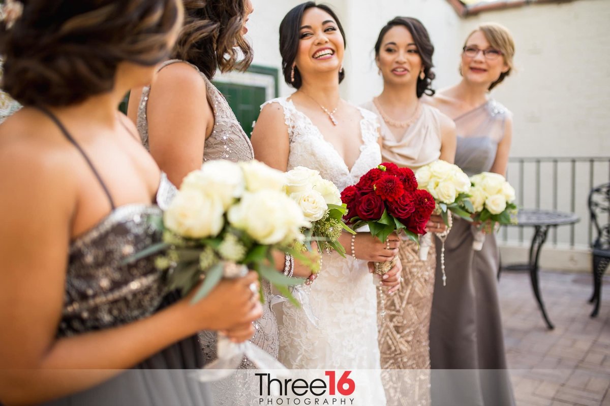 Bride sharing a fun moment with her Bridesmaids