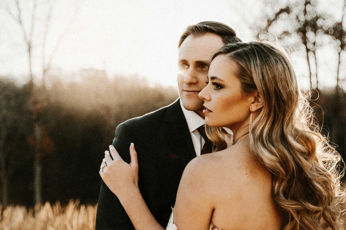 Bride-and-Groom-in-field-close-up-during-sunset-at-Silver-Oak-Chateau-Missouri