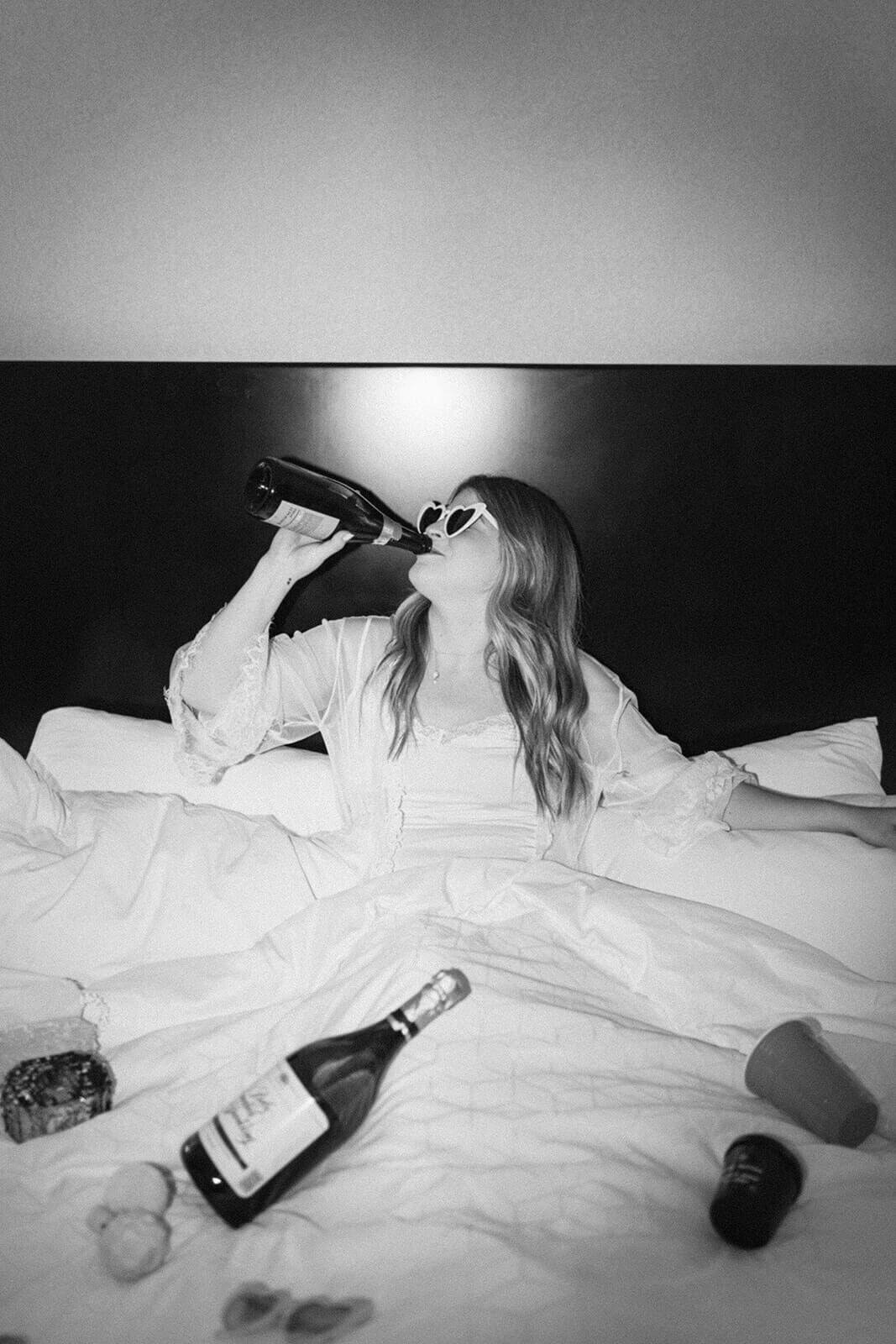 bride-drinks-champagine-on-bed