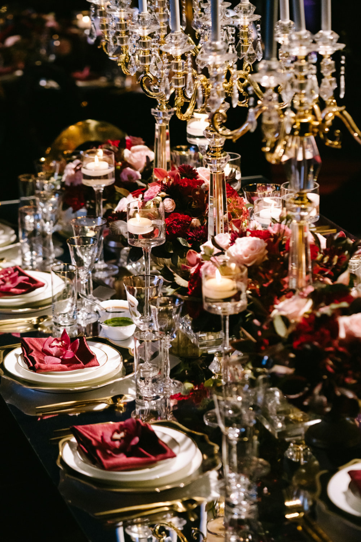 black-gold-burgundy-red-tent-reception-chandeliers-roses-candelabras-napkin-candle