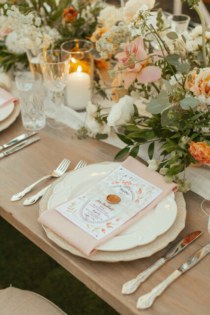 floral menu on charger plate