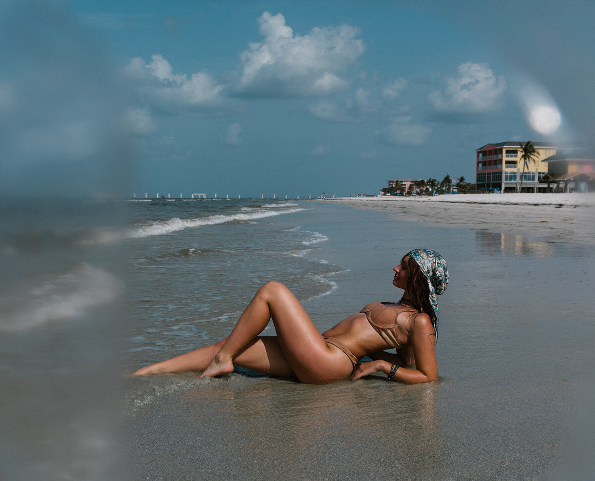 A woman laying on the beach in Fort Myers, florida.