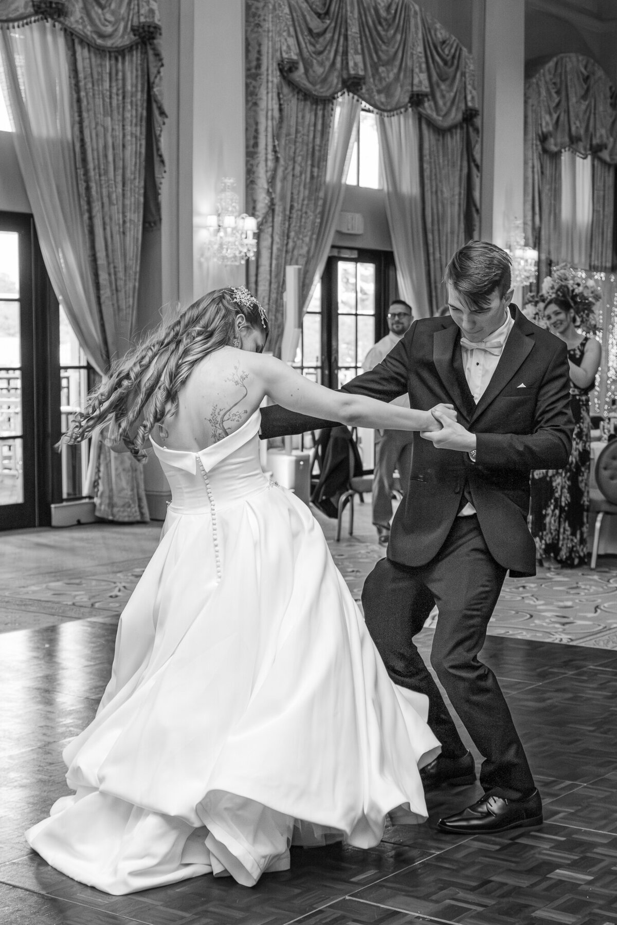 A loving couple dancing at their wedding reception in Cary by JoLynn Photography, a Raleigh wedding photographer
