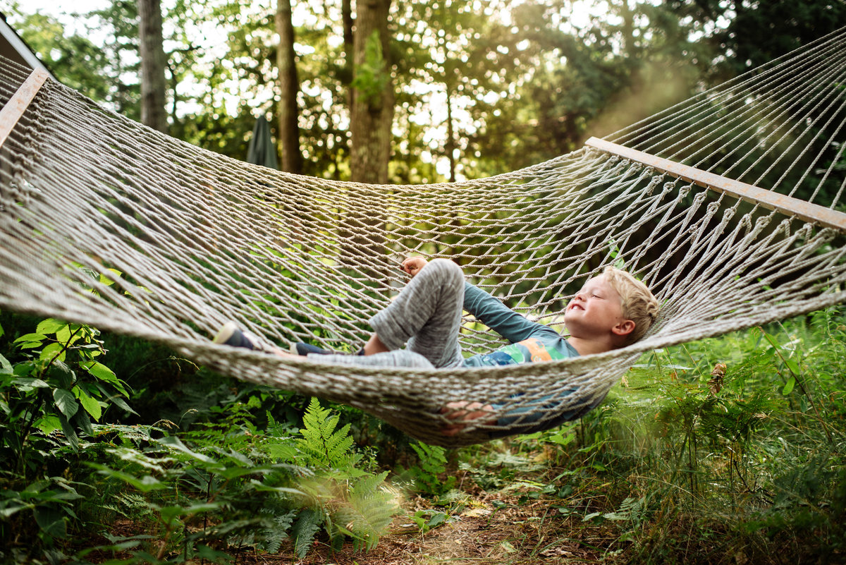 Child playing in a hammock
