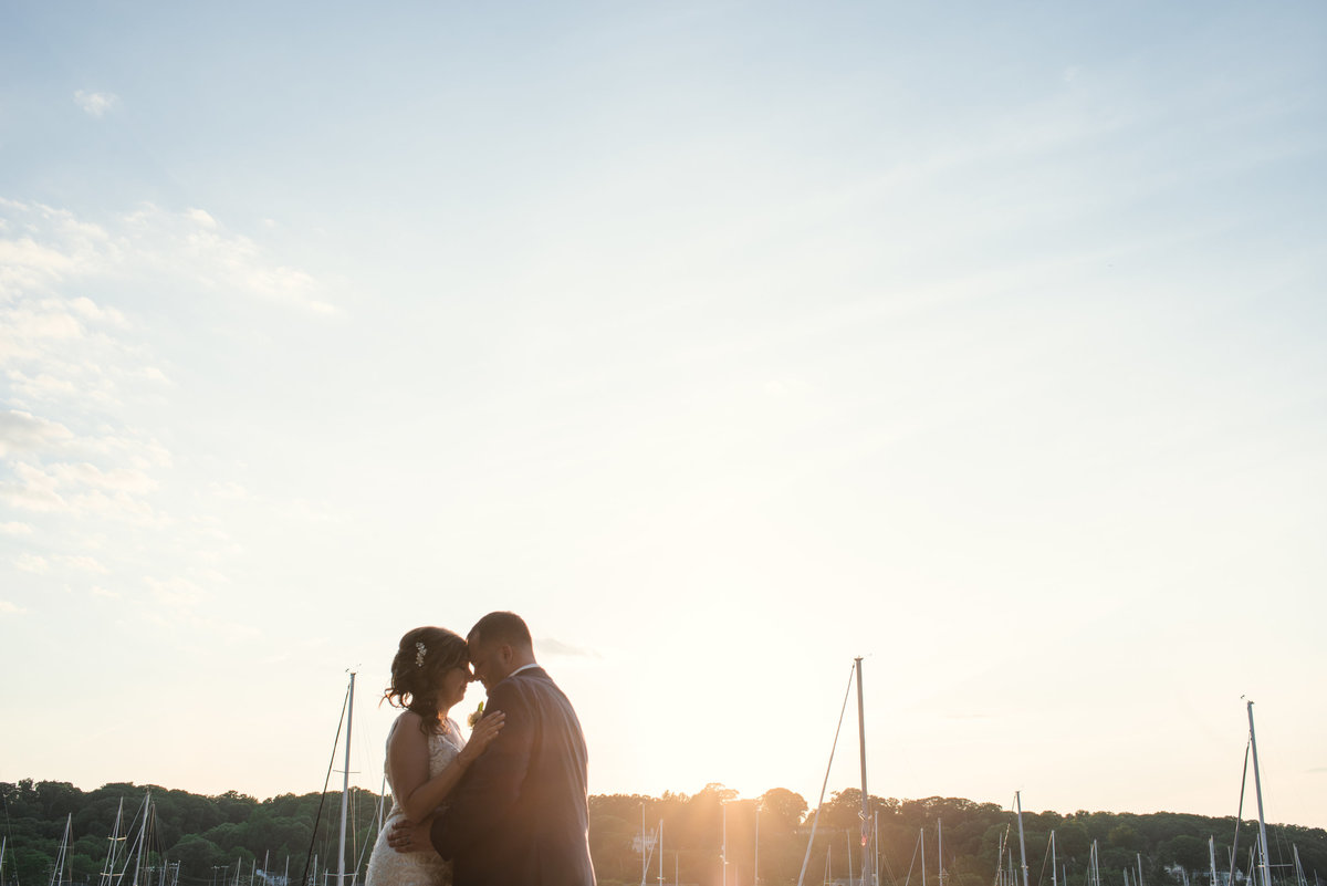 Bride and groom at Sunset at Harbor Club at prime