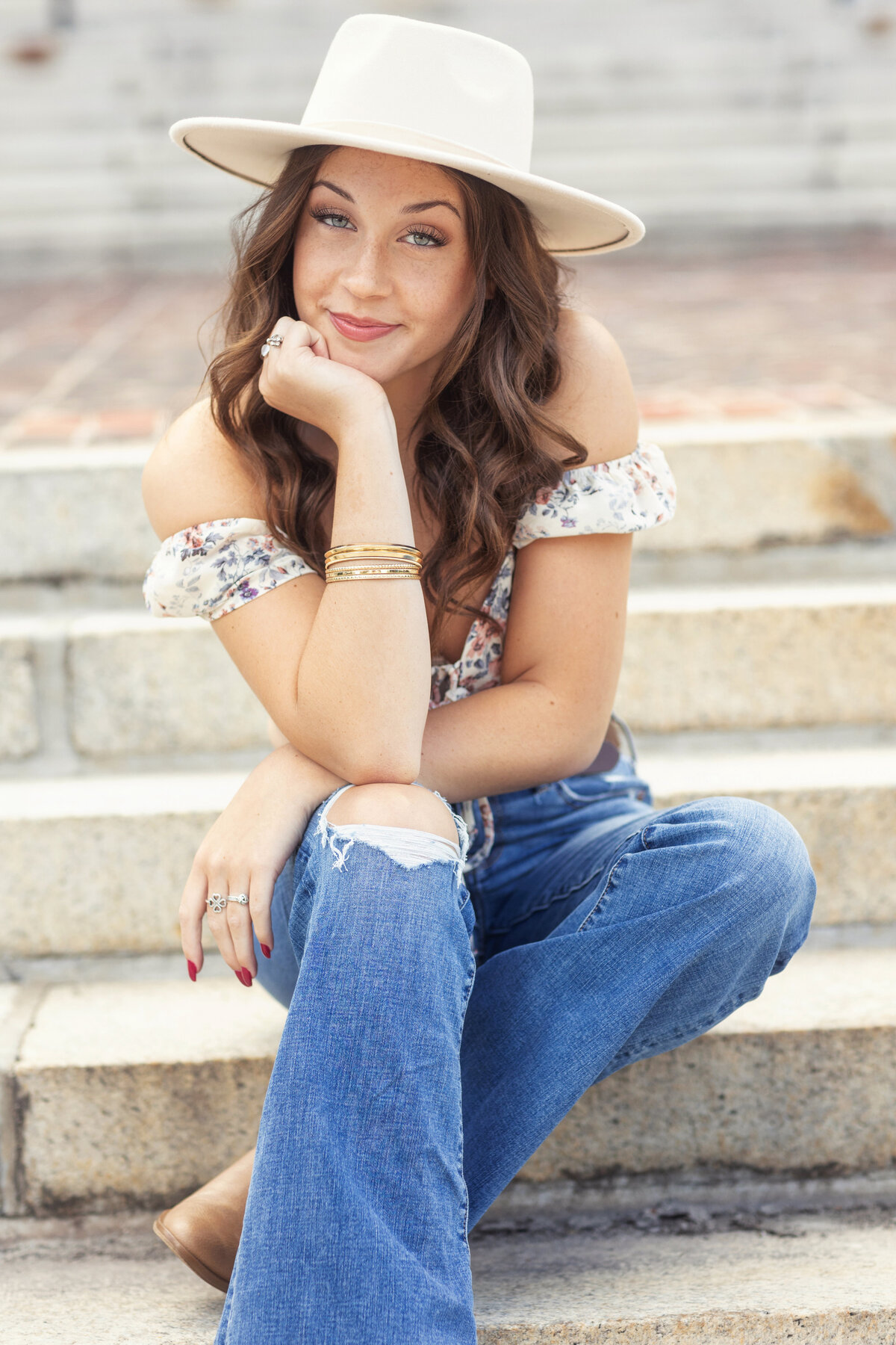 senior girl with hat on stairs - Kristen Zannella Photography
