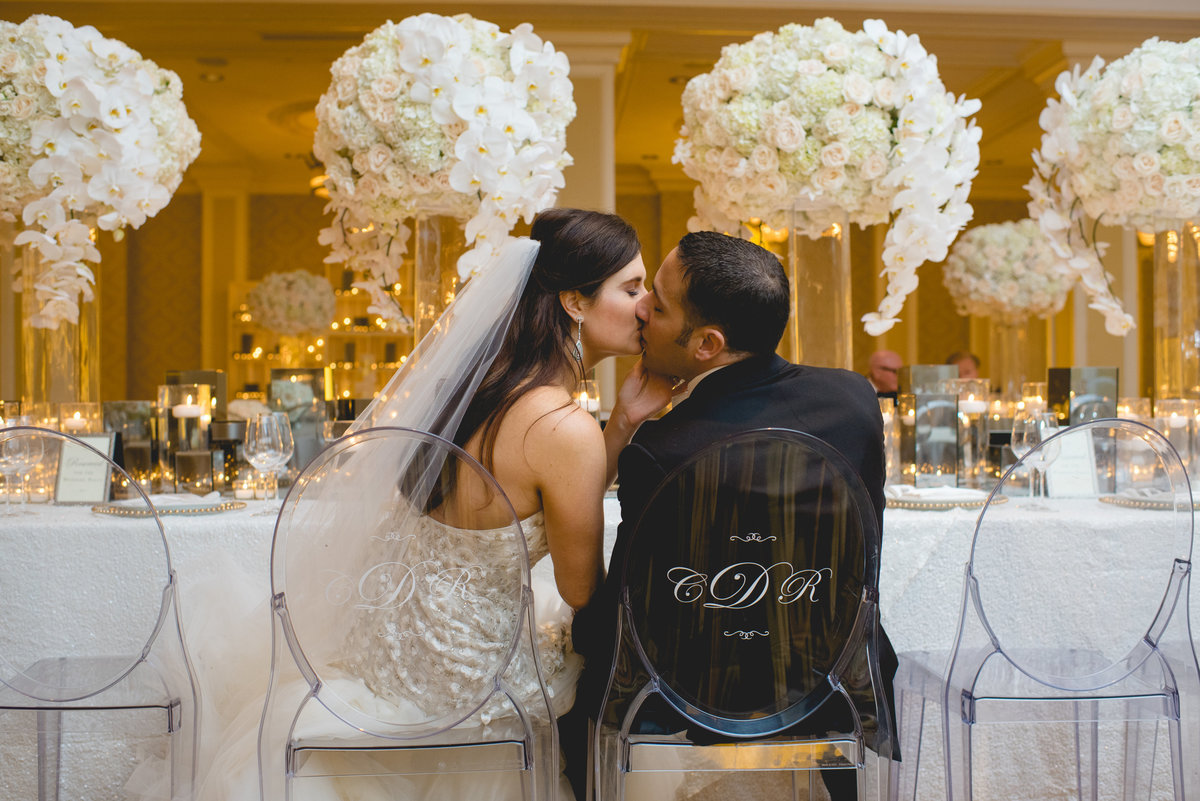 clear chairs inscribed with bride and groom's names