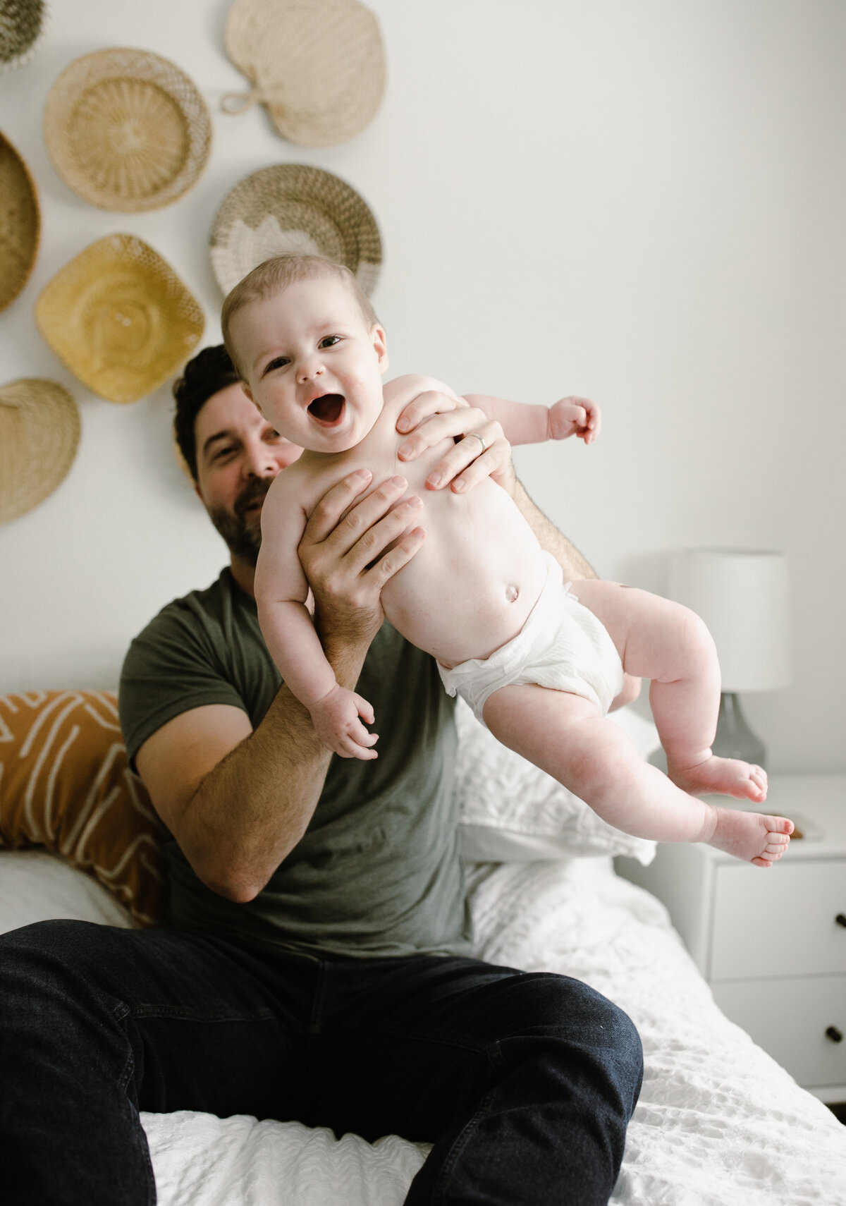 Father holding baby in the air at Austin family photo session