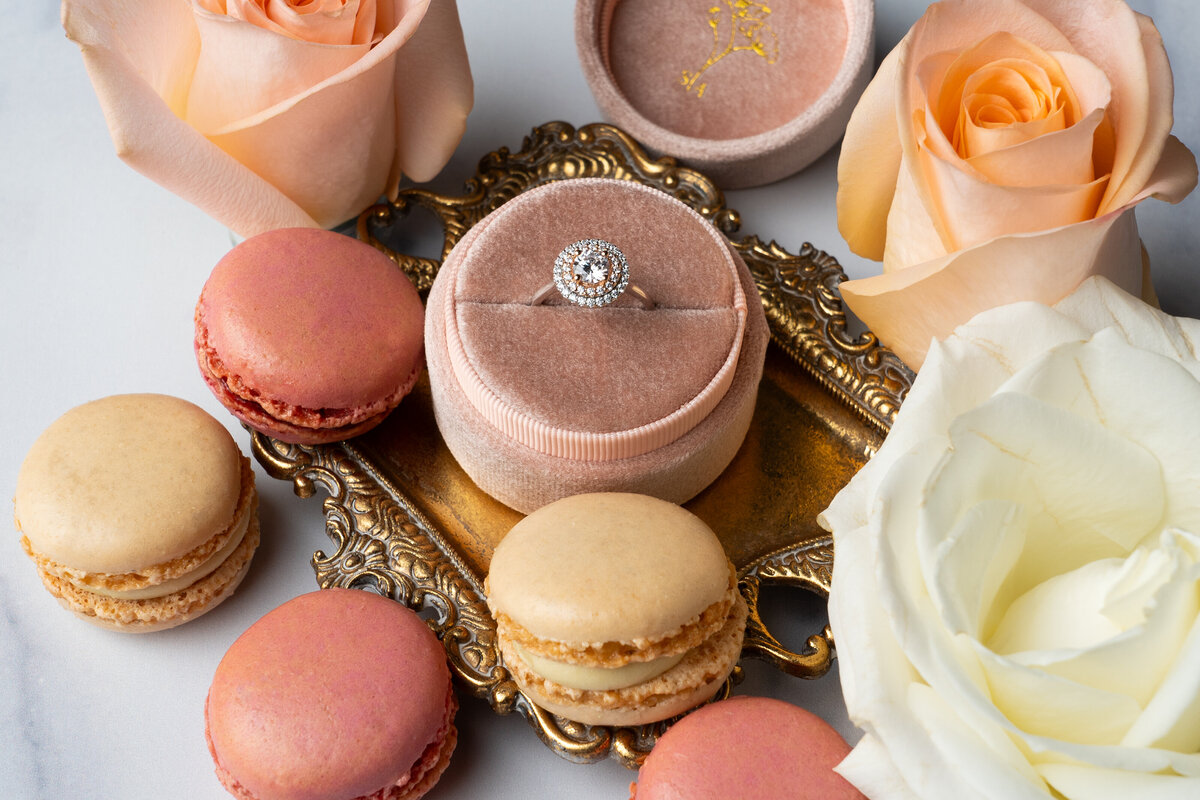 Delicious Macarons surround a two tone halo ring