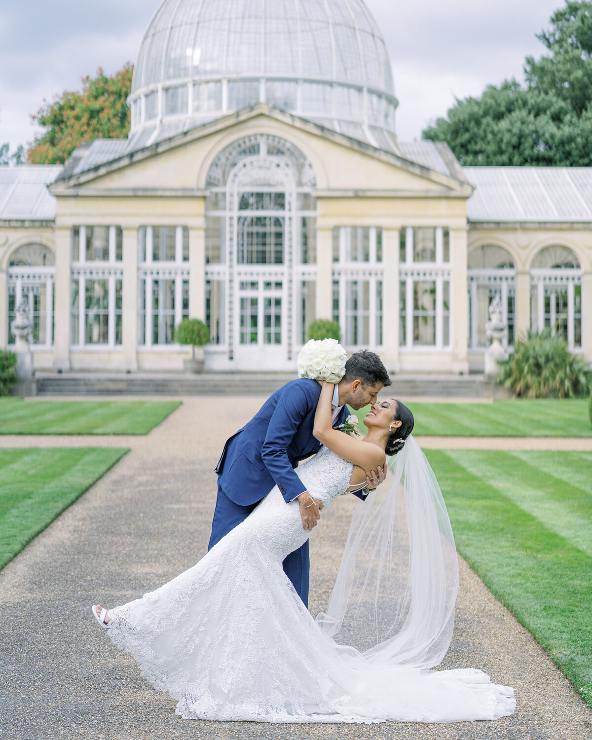 Bride and groom kissing at Syon Park wedding venue in London