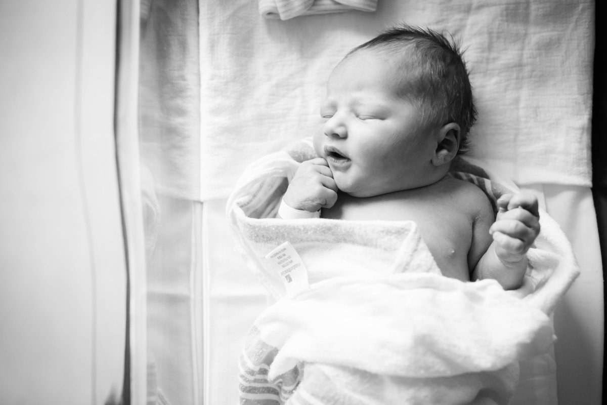 baby swaddled at hospital for newborn photos