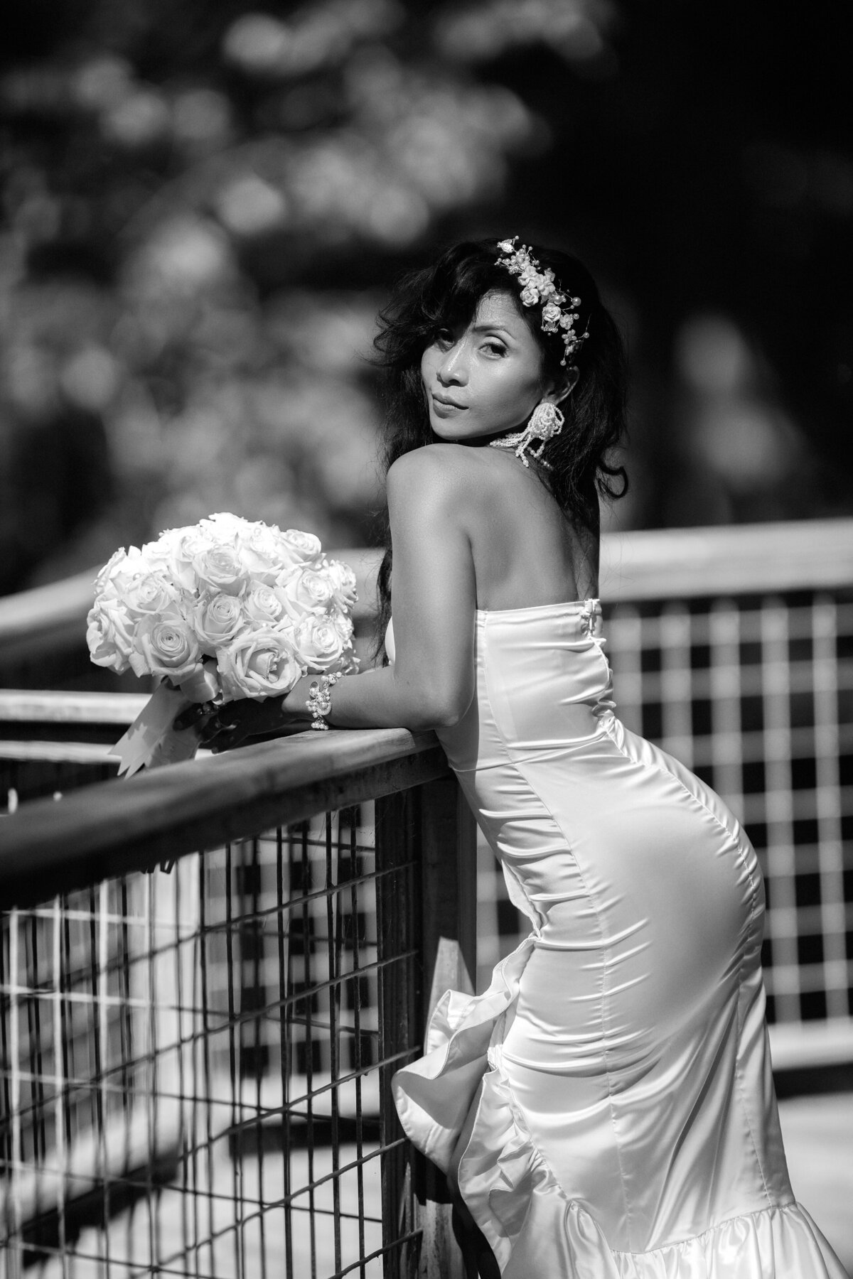 black and white picture of  bride showing her curves