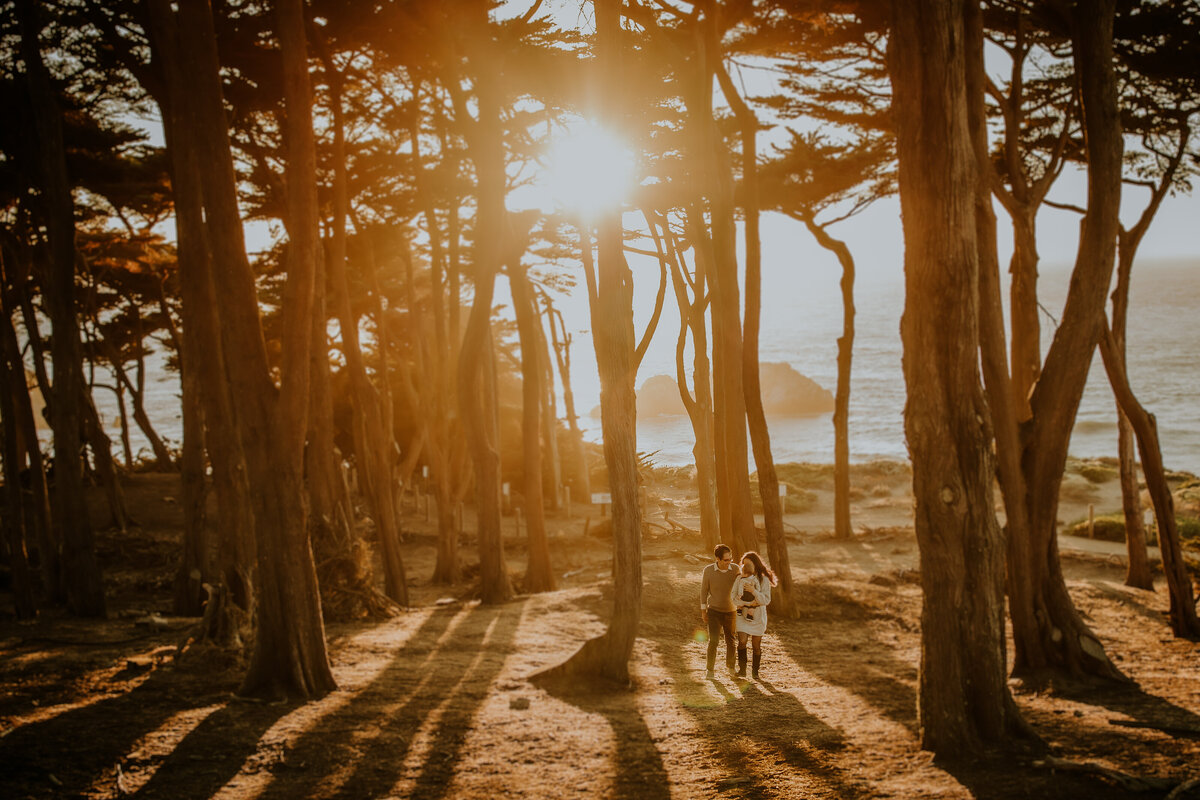 Environmental portrait of family walking togeher at sunset at Lands End