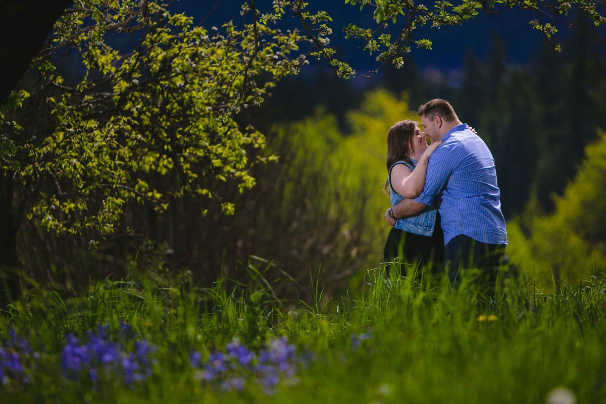 Kissing on the farm at engagement session