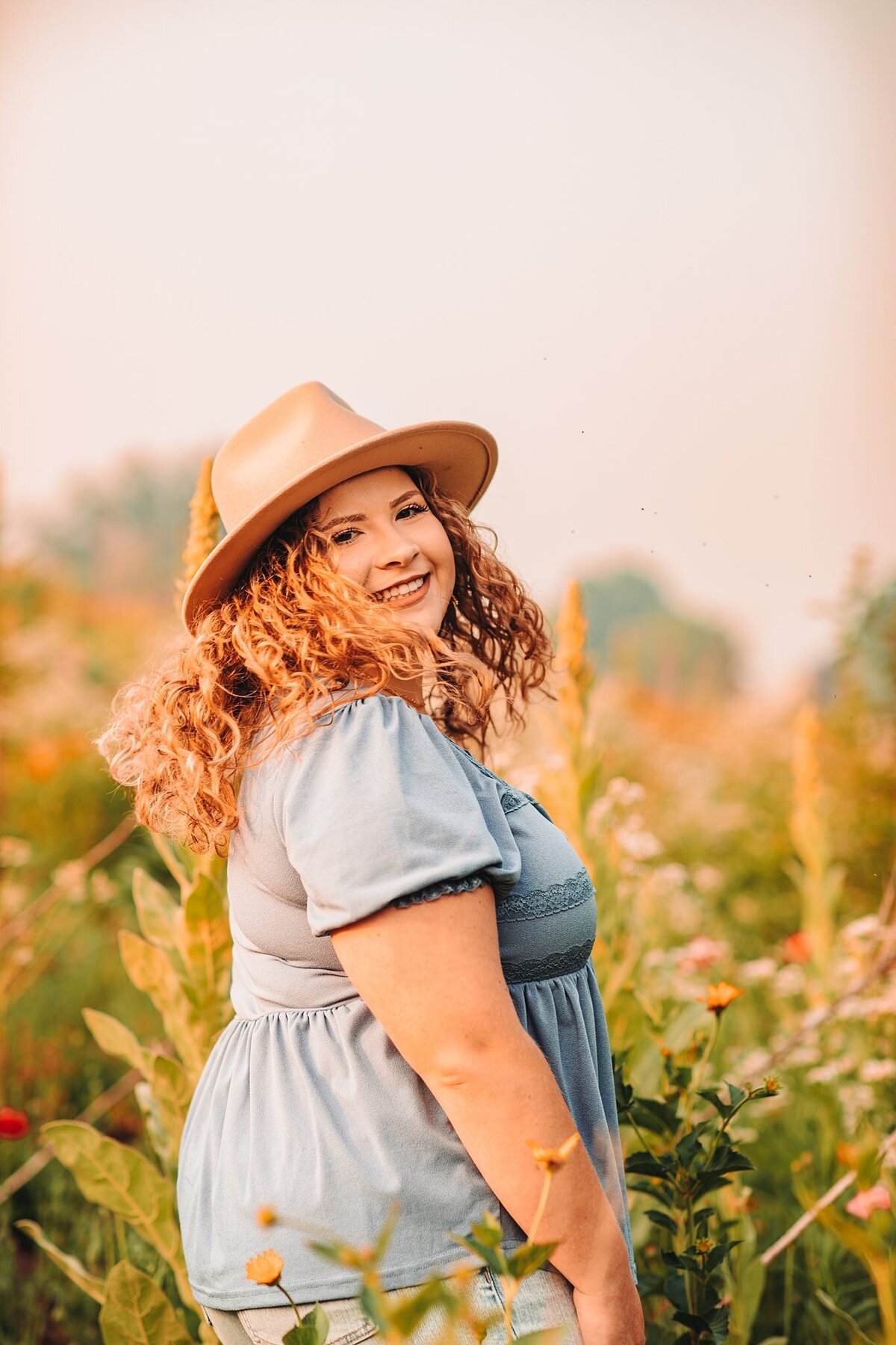 benton-senior-photographer-wisconsin-girl-wild-flower-field-with-hat