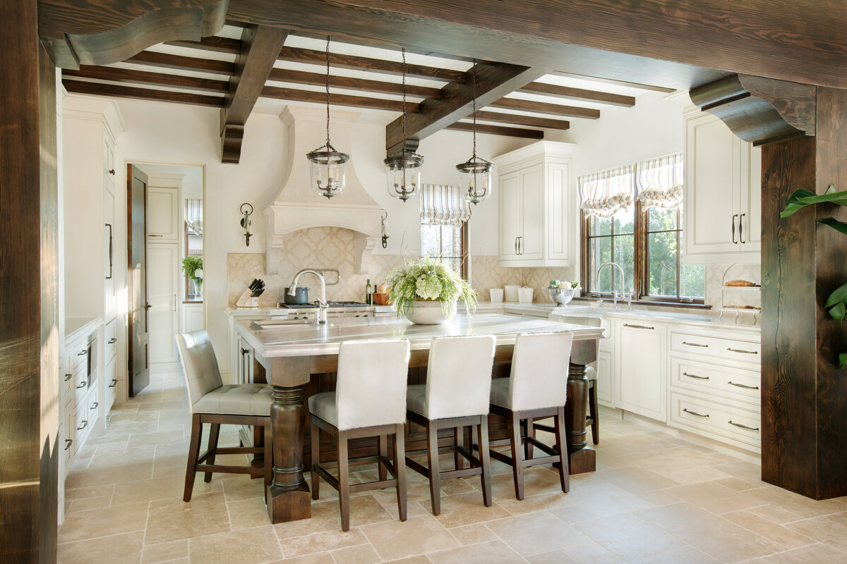 Panageries Commercial Interior Design | Gabriel Builders Showroom Kitchen Design with Exposed Wood Beams and White and Cream Hues