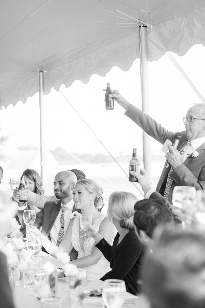photo of wedding dinner toast - gold shoes and wedding details - branford house wedding