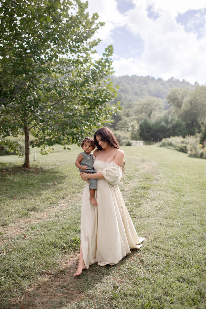 Family session of little boy with mother in a dress