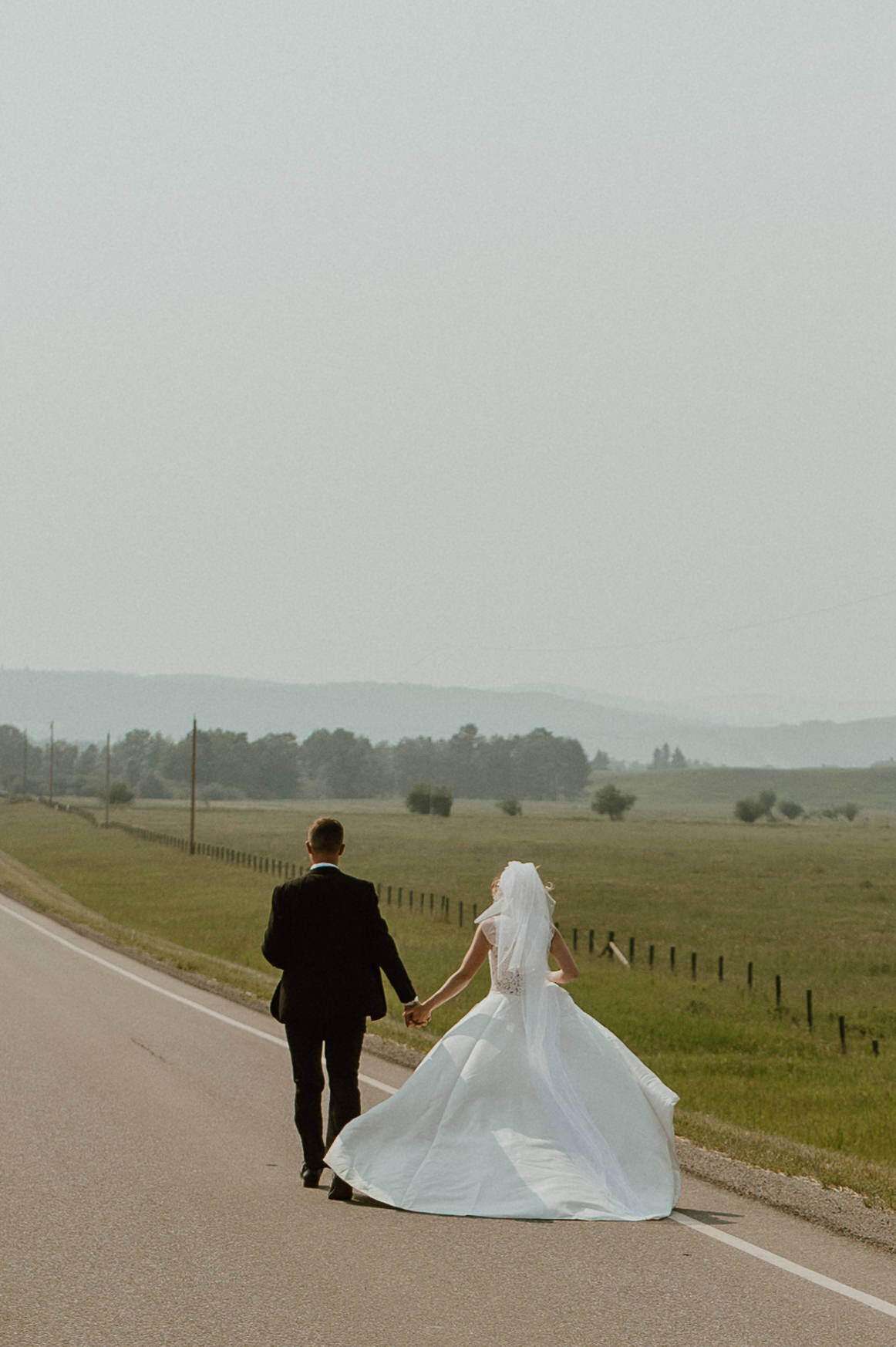 runaway country wedding couple in Alberta