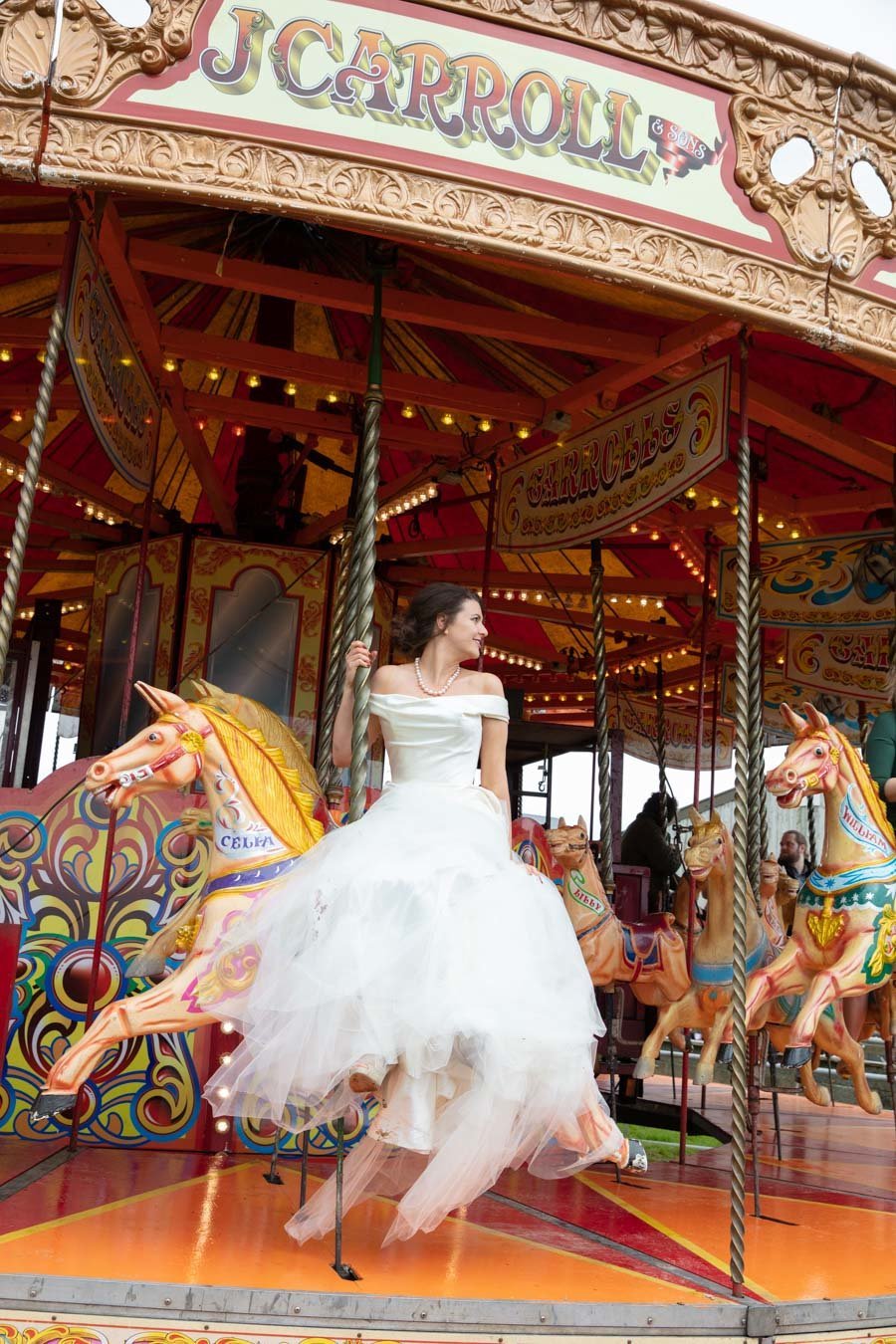 Bride on a fairground ride at The Barn South Milton