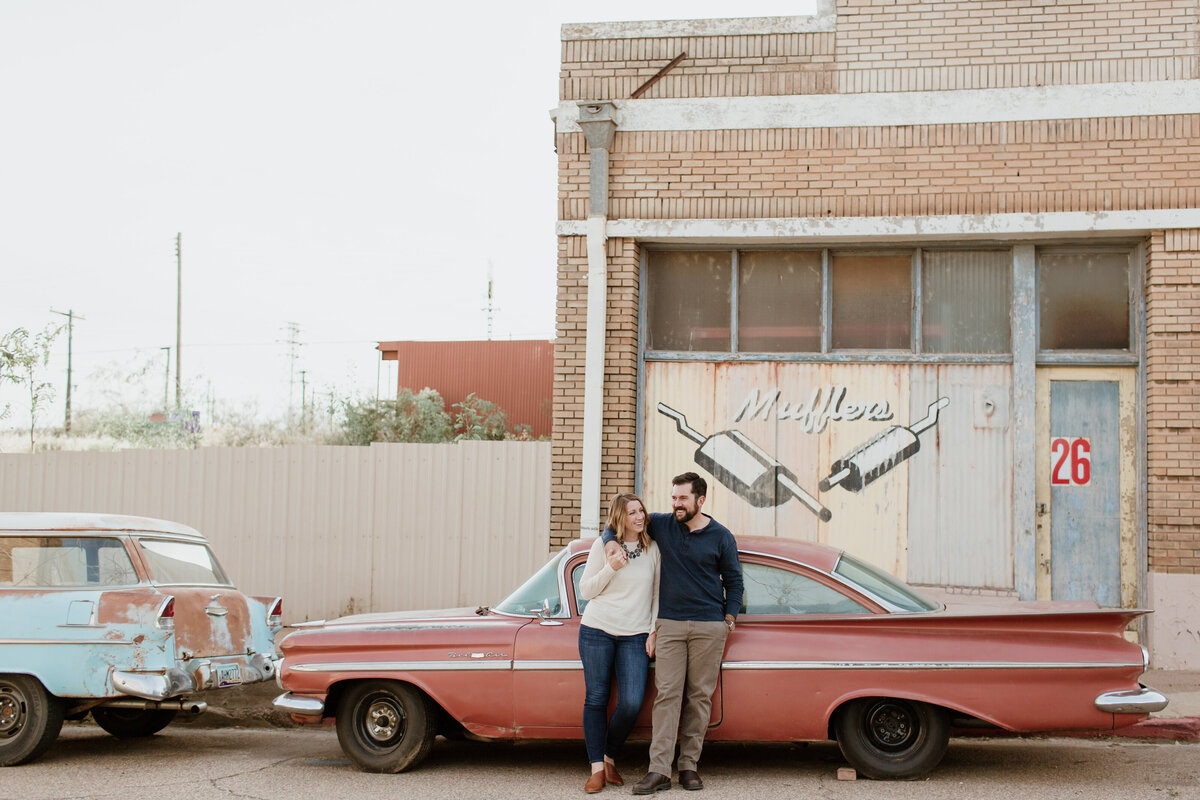 A playful outdoor engagement session with classic cars captured by Fort Worth Wedding Photographer, Megan Christine Studio