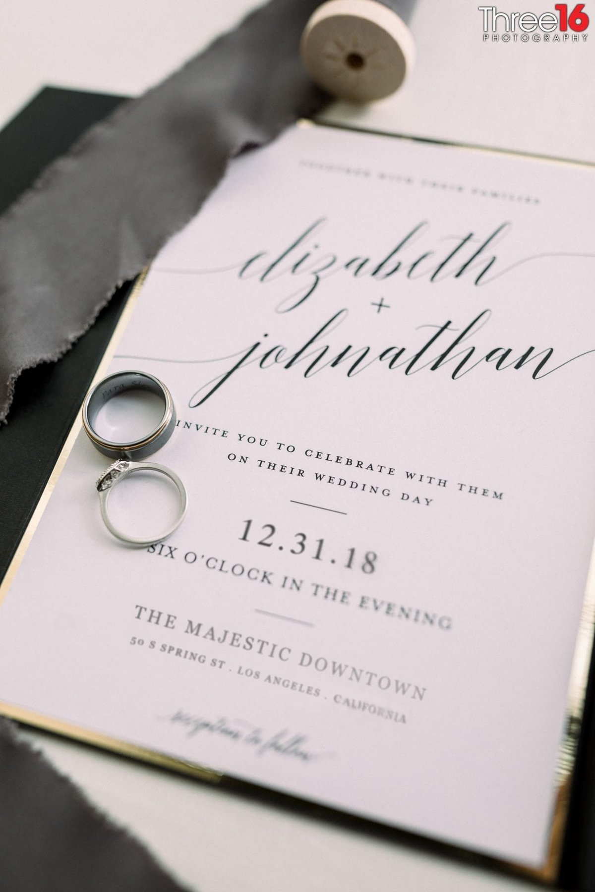 Wedding invitation and wedding rings