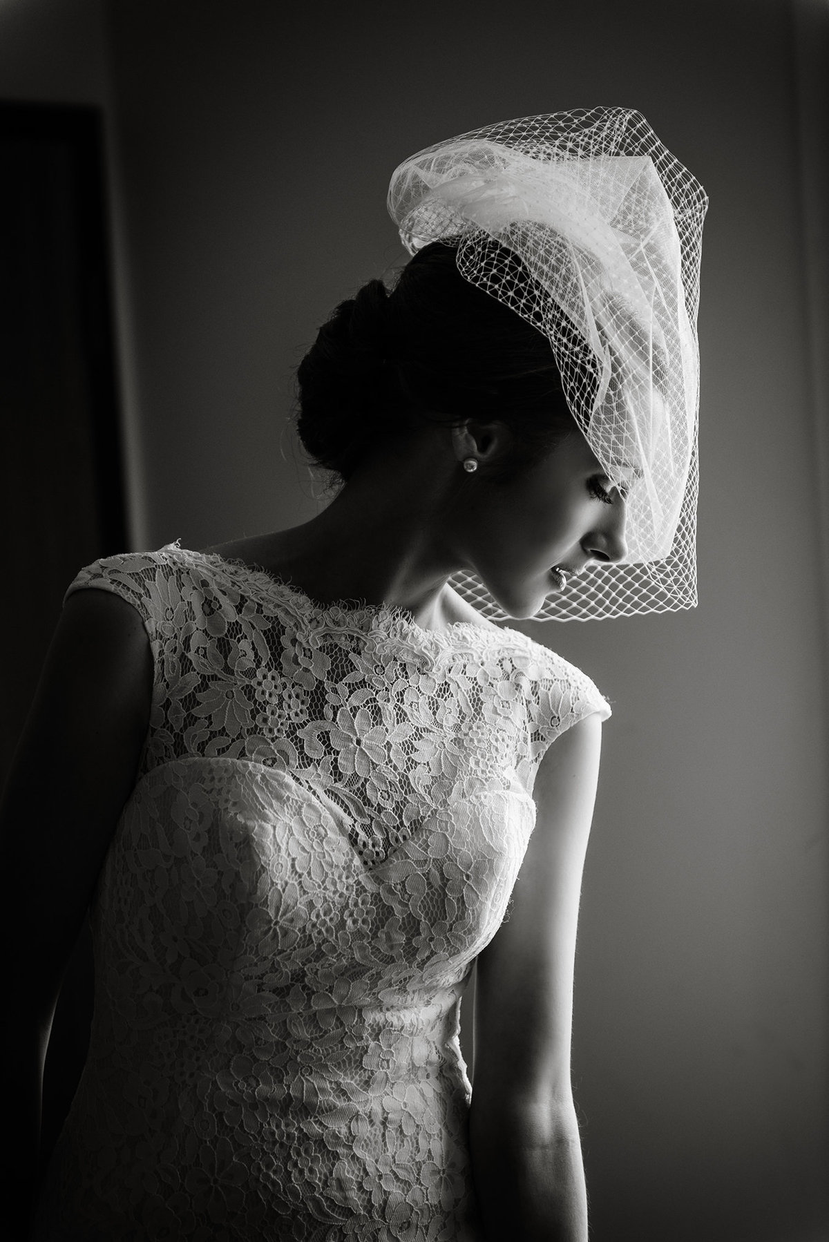 Black and White profile of  Bride wearing a blusher veil