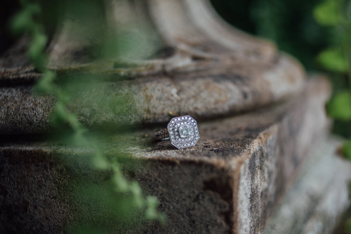 A ring sat at the base of a stone pillar  taken by London Wedding Photographer Liberty Pearl