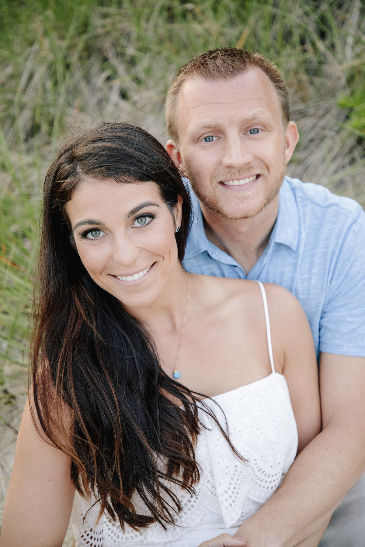 engaged couple on beach in manasquan