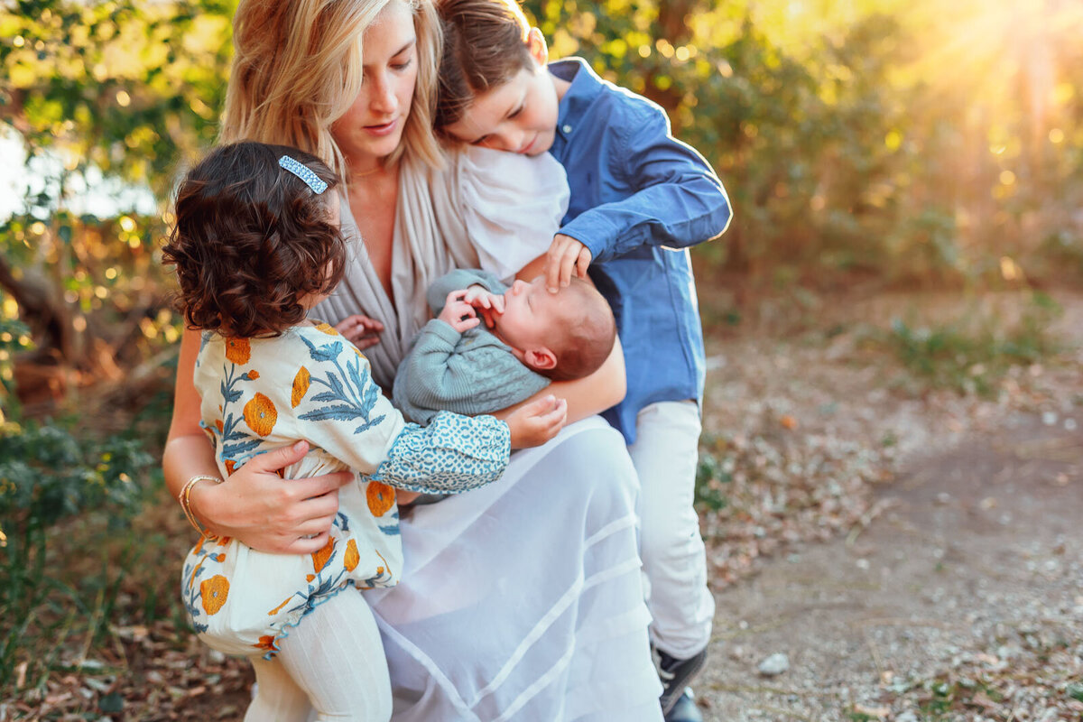 mother with children during family photo session on long island