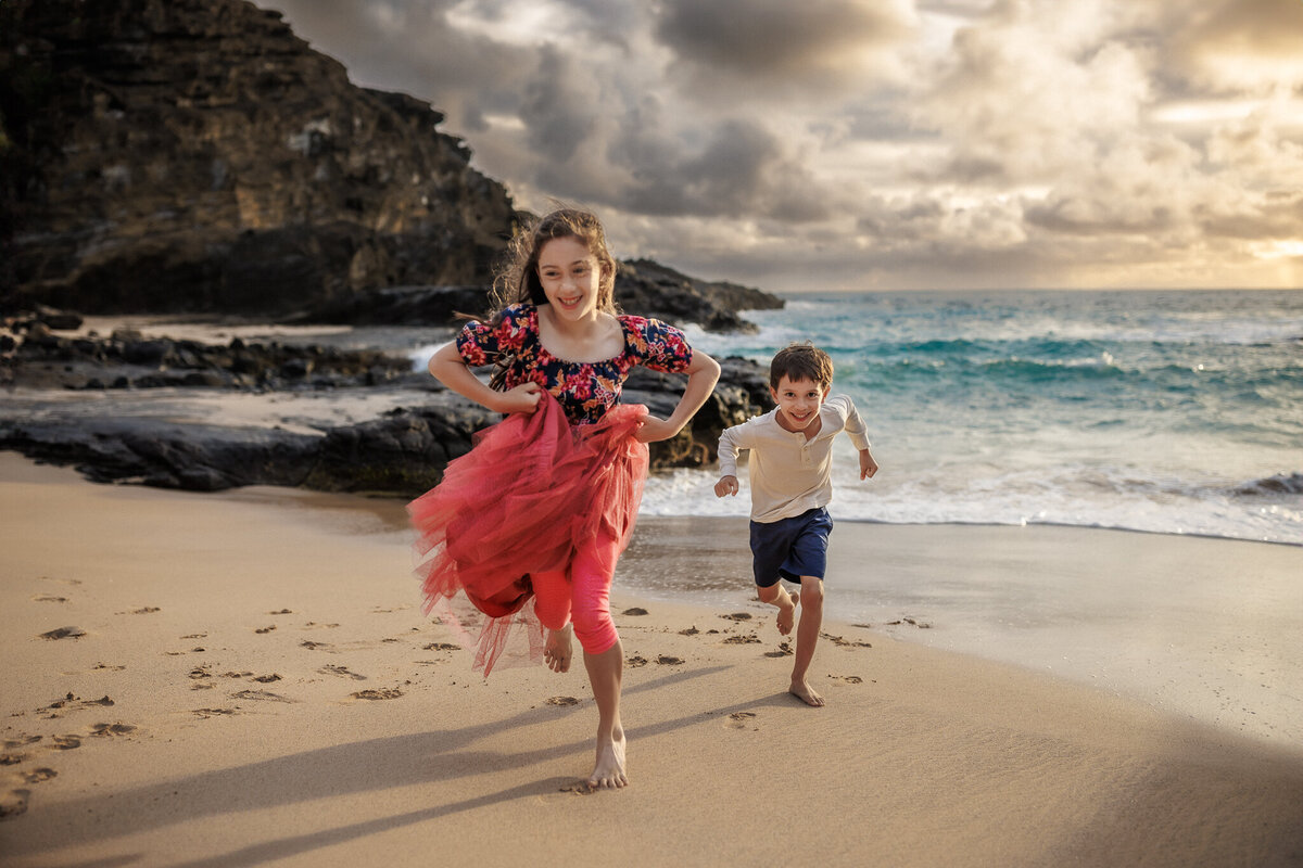 children running on Hawaii beach