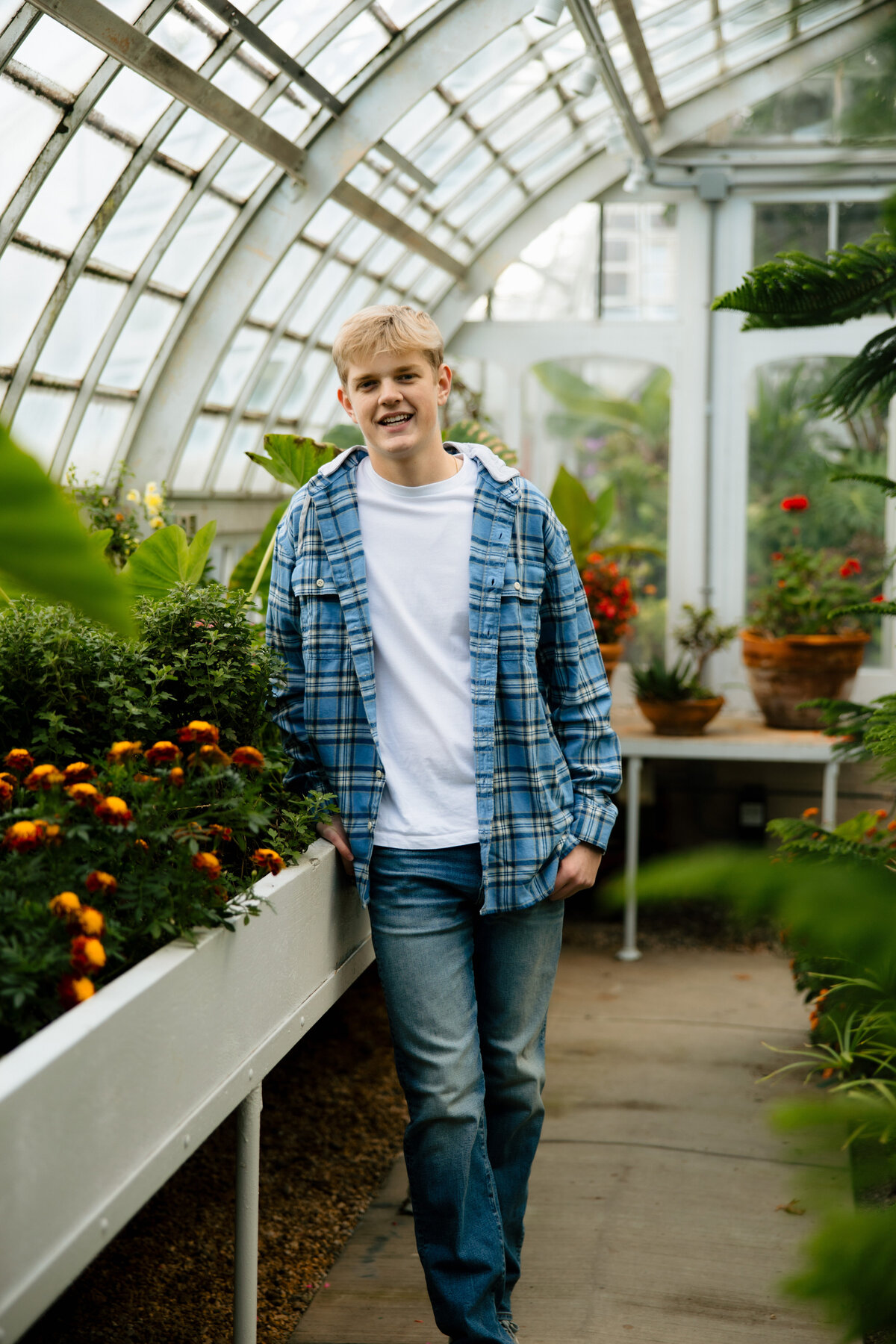 senior-guy-portrait-in-greenhouse