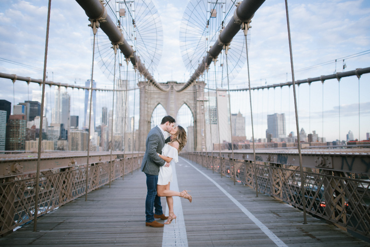 nyc engagement session brooklyn bridge kiss candid nyc ny new york skyline candid