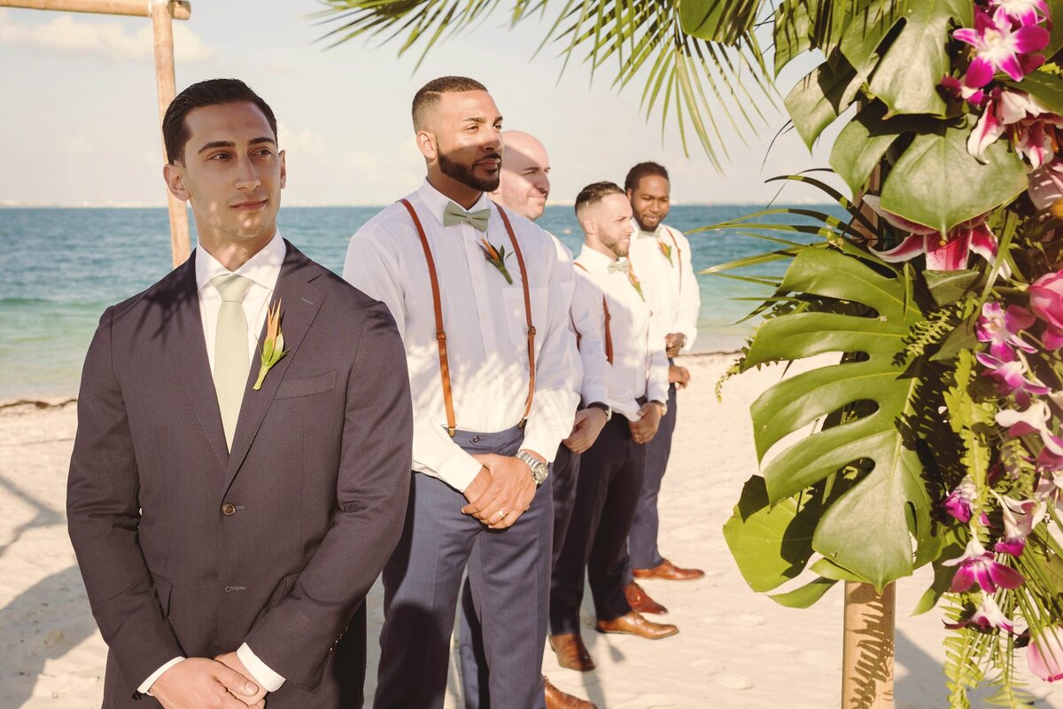 Groom waiting for bride at beach wedding in Cancun