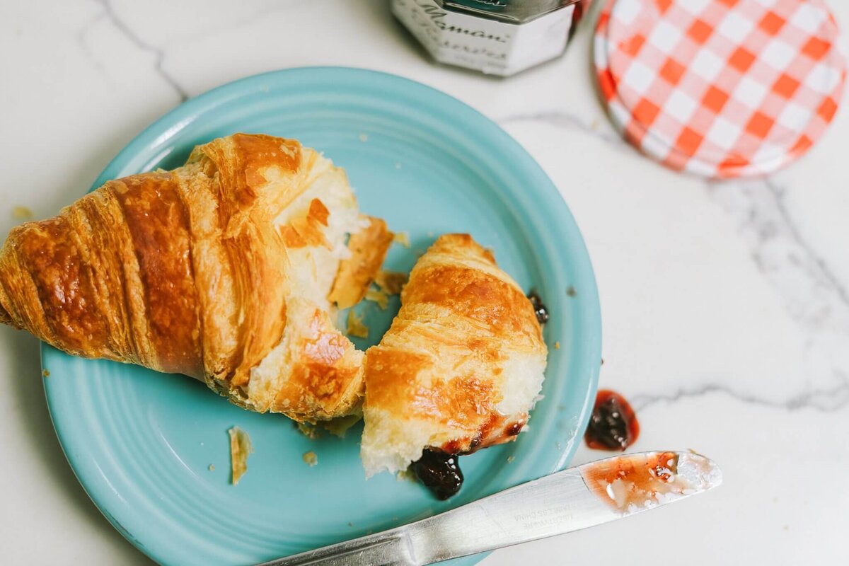 Natural light branding session at a local Tahoe bakery showing product, and yummy croissant half eaten.