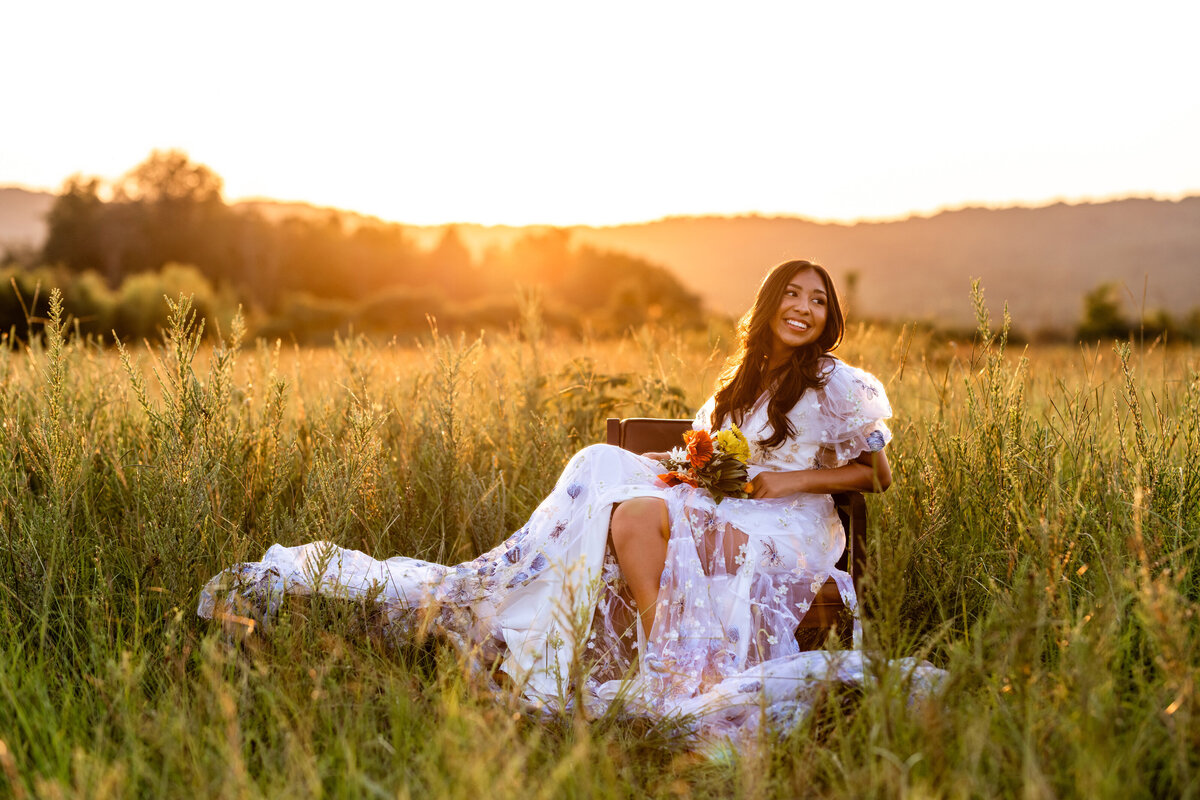 Professional senior photographer in Birmingham, AL takes photos with mountain backdrop. Vestavia photographer.