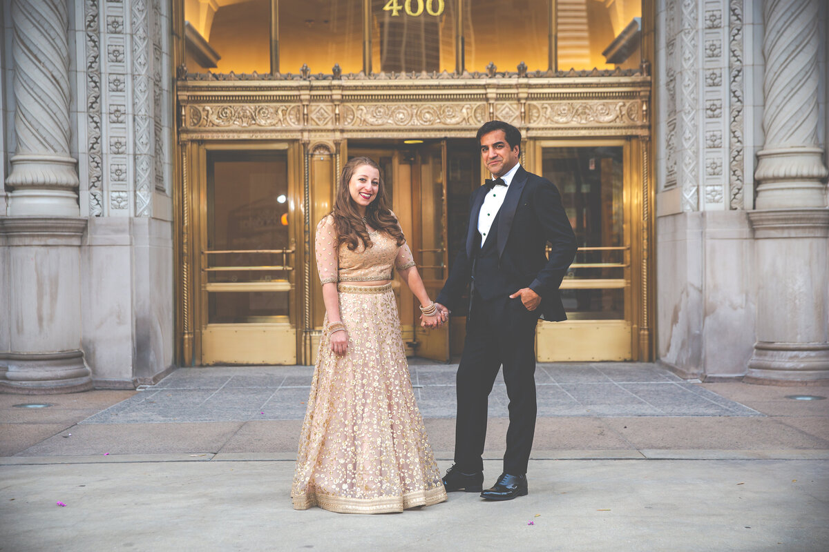 A beautiful downtown Chicago Indian wedding portrait with a golden door in the background.