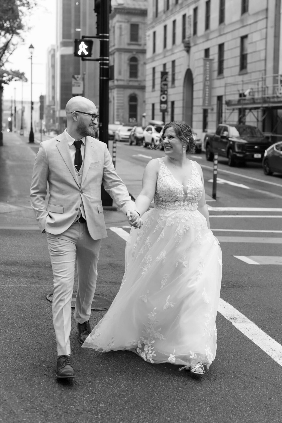Bride and groom crossing a street at  at Halifax Club wedding in Nova Scotia