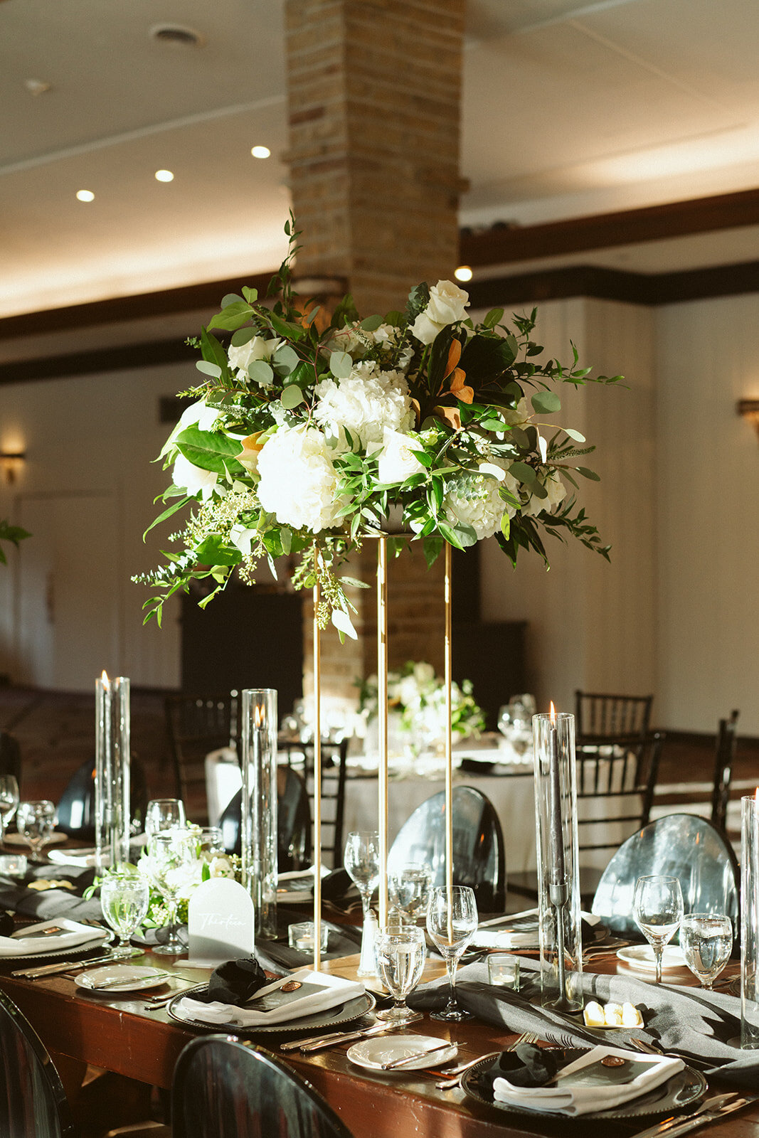 Tall flower centrepieces for winter wedding at mountain lodgel.