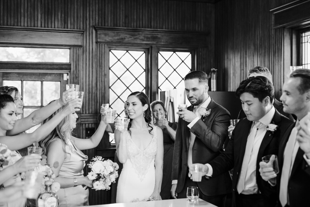 Bride and groom cheersing with wedding guests at wedding at The Grand Lady Austin